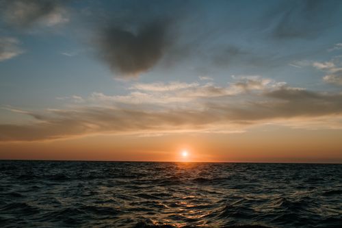 Free Tranquil sunset over the ocean near Sakhalin, showcasing beautiful sky and water. Stock Photo