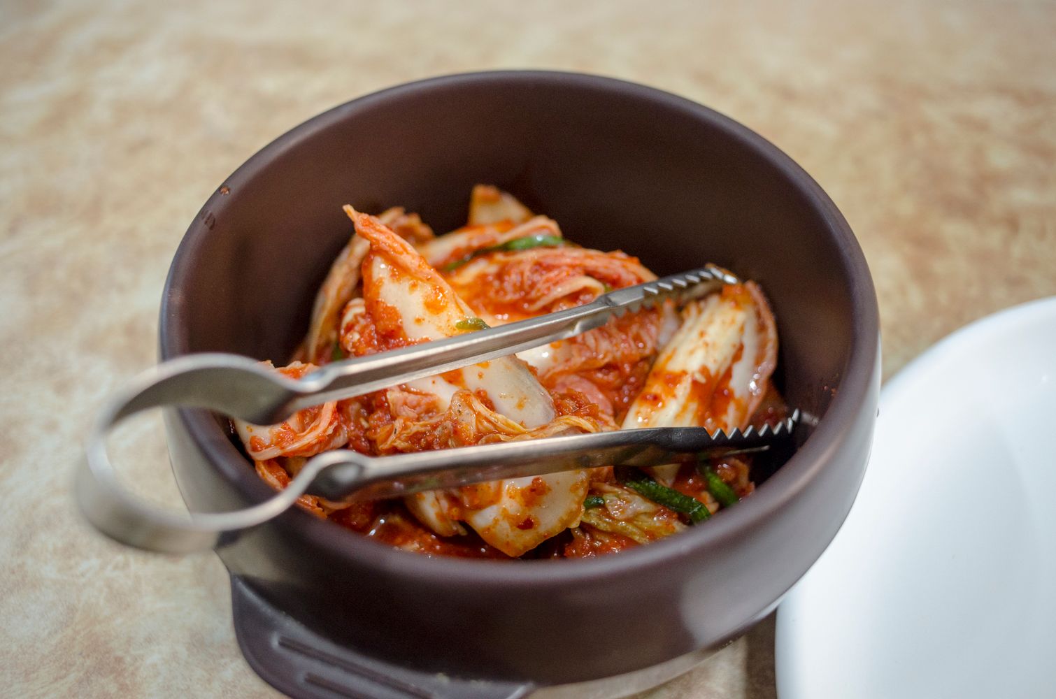 Herb-Crusted Kimchi Jjigae with Toasted Sesame
