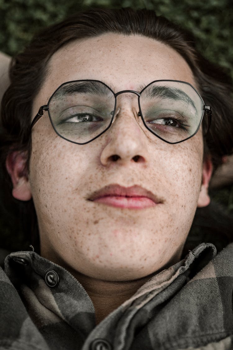 Freckled Person Wearing Black Framed Eyeglasses