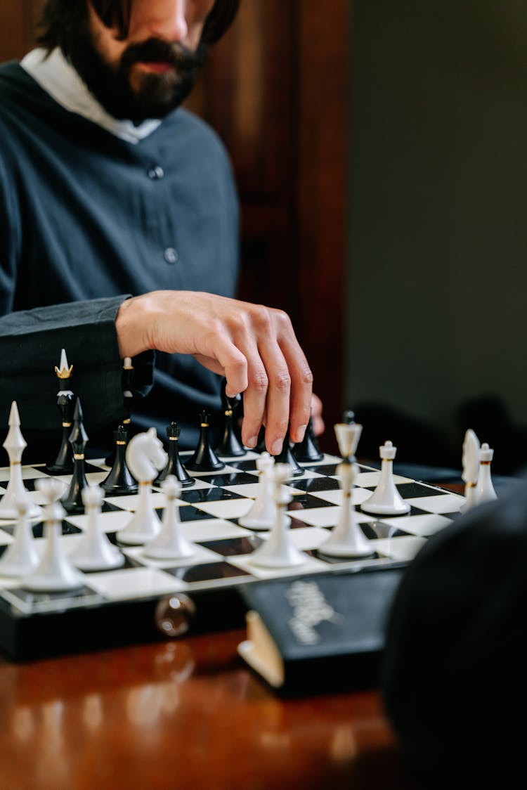 Person Playing A Board Game