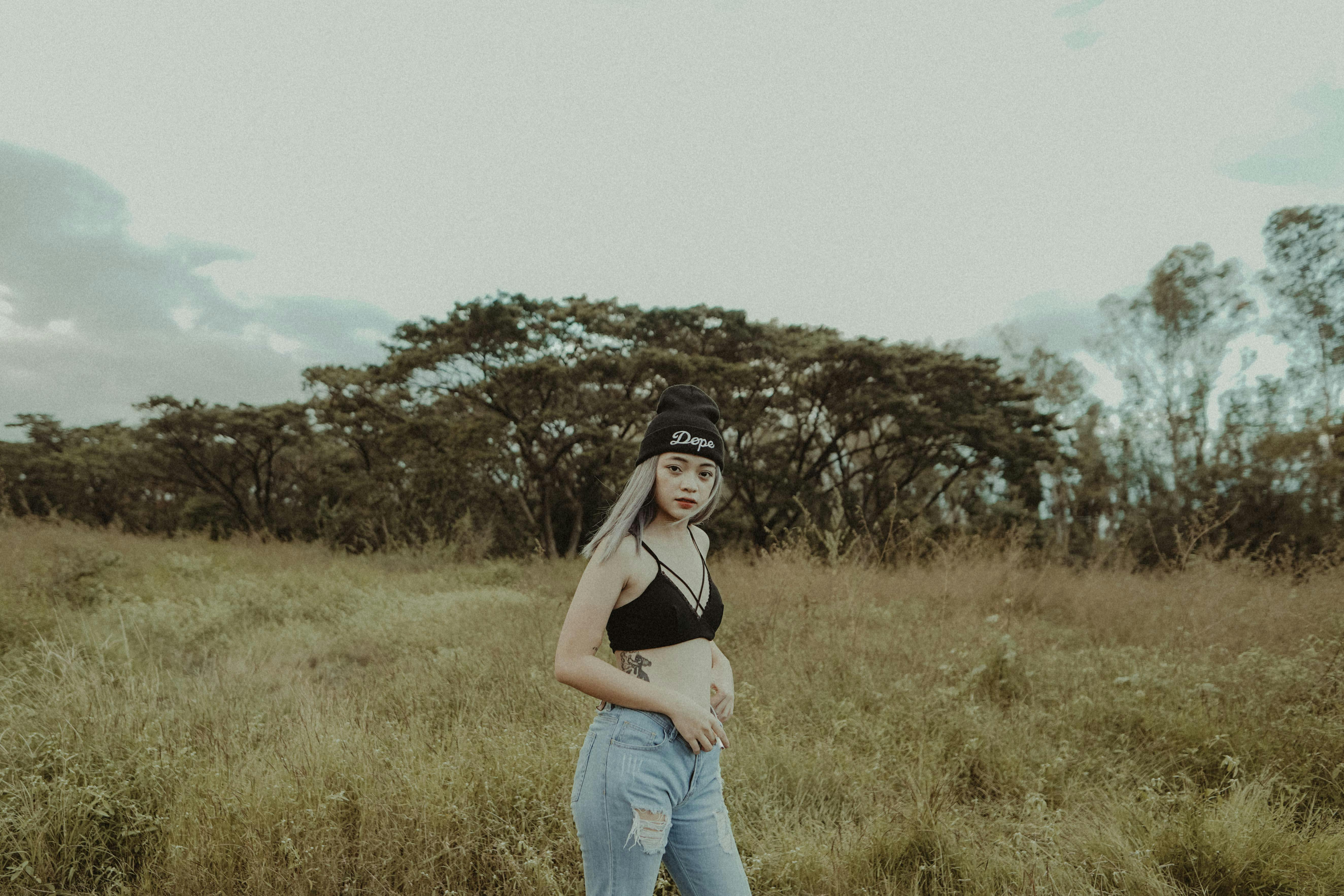 Beautiful Woman in Black Crop Top and Denim Jeans · Free Stock Photo