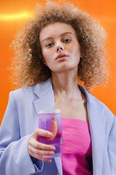 Woman in Pink Shirt Holding Clear Drinking Glass