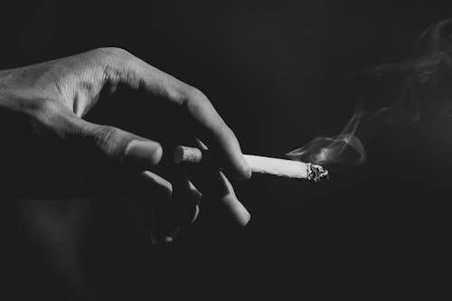 Free Person Smoking a Cigarette i Stock Photo