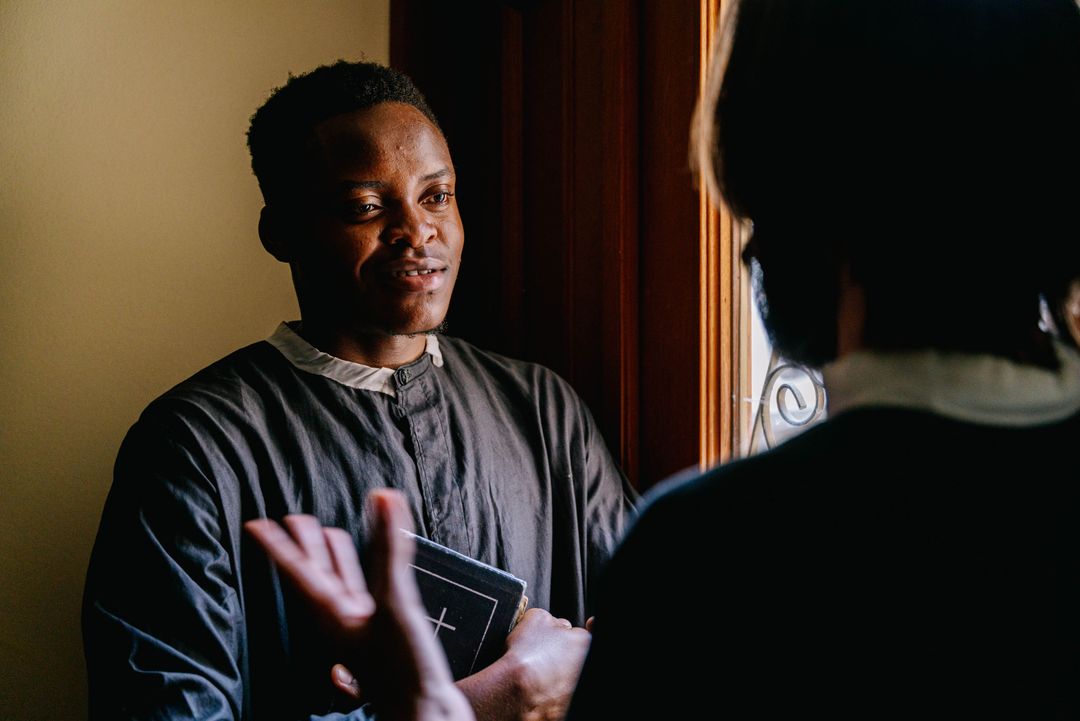 Men discussing faith with an open Bible
