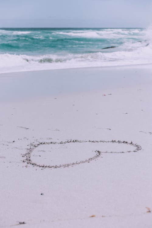 Heart Drawing on the Beach Sand