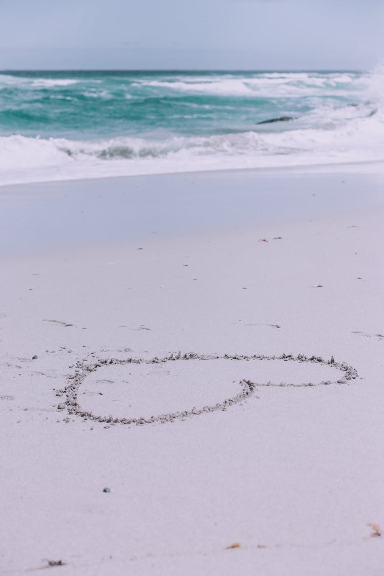 Heart Drawing On The Beach Sand