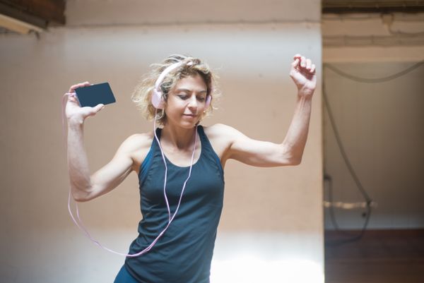 Woman dancing at home during an online Zumba workout