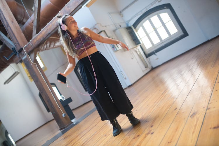 A Woman Dancing Listening To The Music