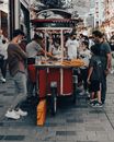 People Standing and Sitting on Street