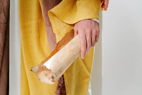 A Person Holding Brown Paper