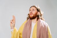 A Jesus Look Alike Man in Yellow Robe