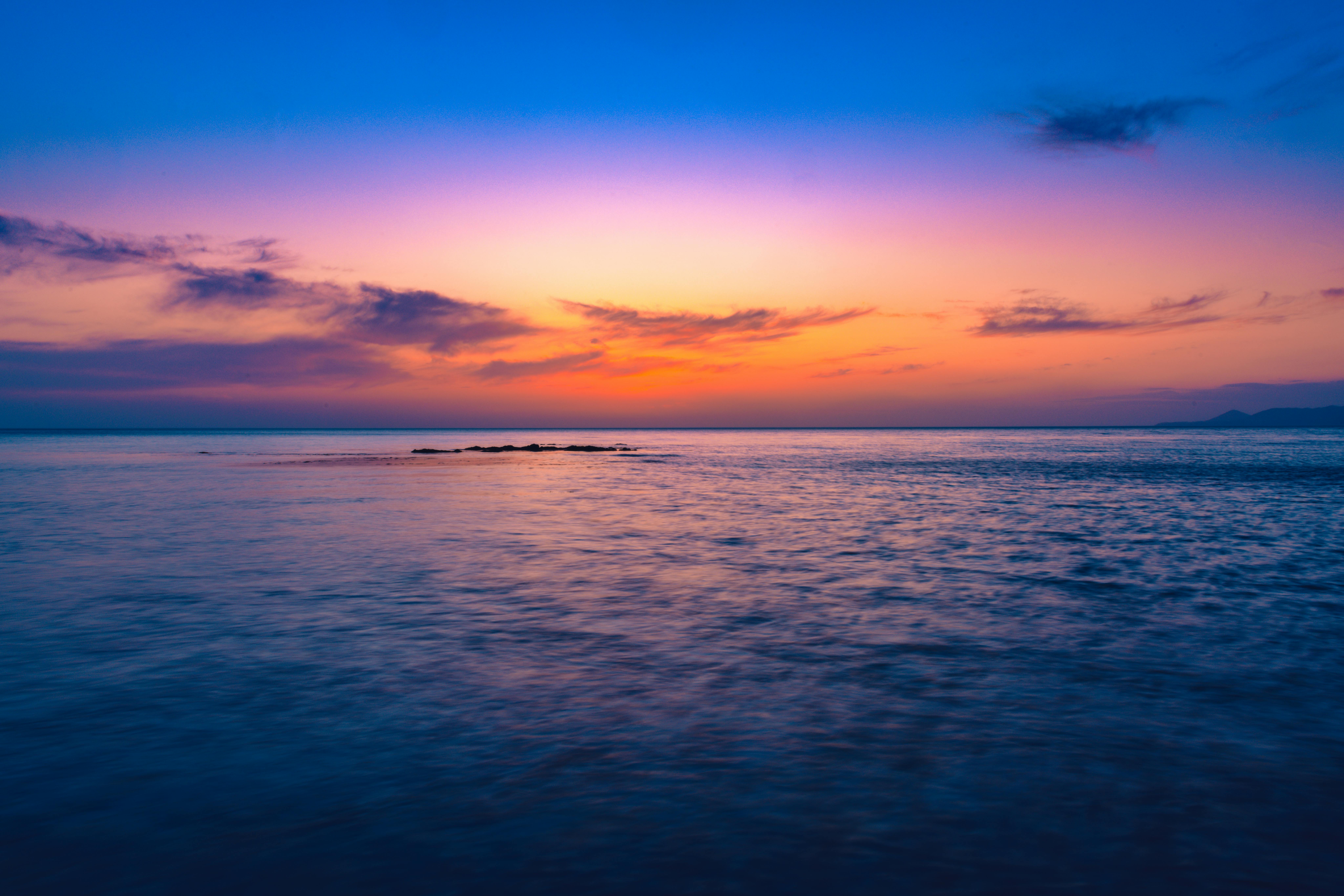 Stunning sunset over the tranquil sea in Sochi, Russia, with colorful sky and serene waters.
