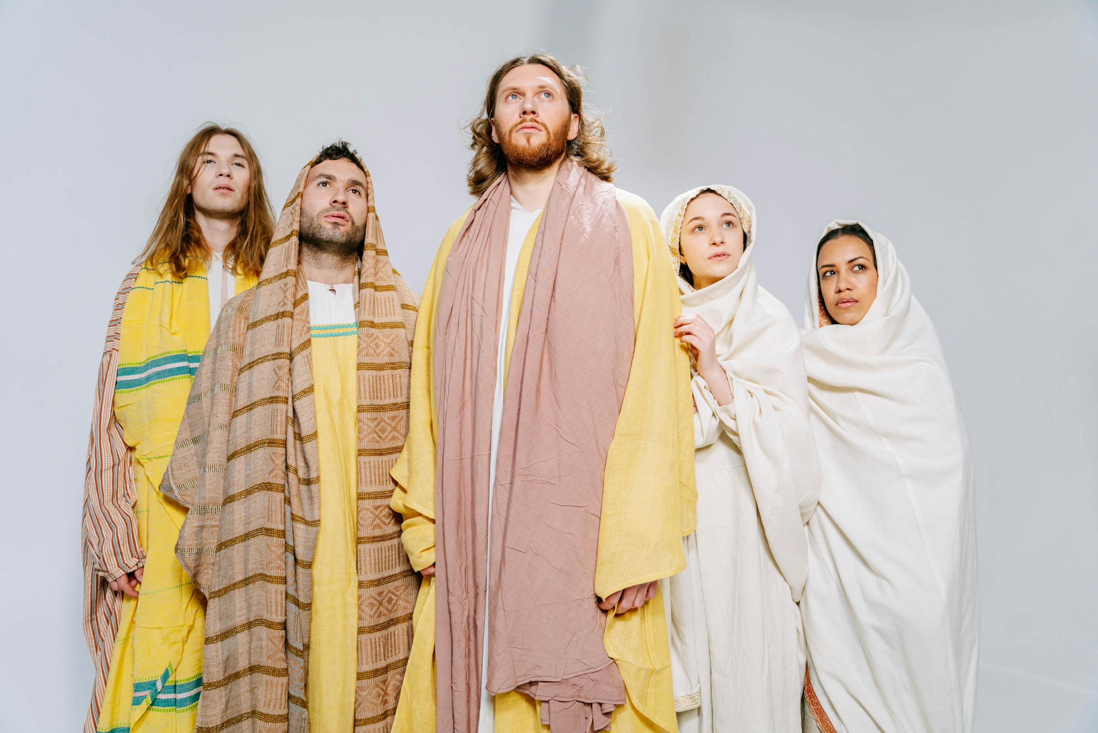 People Wearing Yellow and White Robes · Free Stock Photo