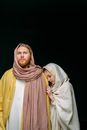 A Woman Standing Beside a Man