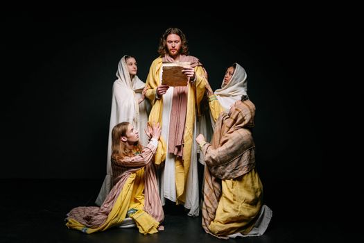 A theatrical scene showing actors in biblical costumes dramatizing a religious theme.