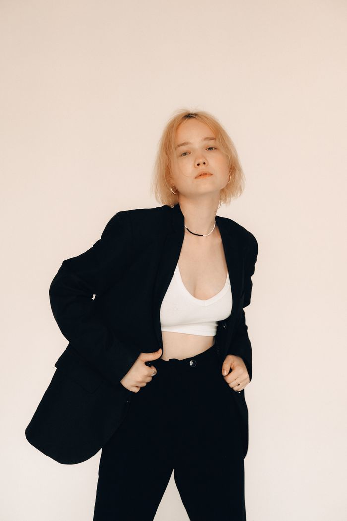Editorial fashion portrait in a black tailored suit, by Alexandra Kollstrem on Pexels