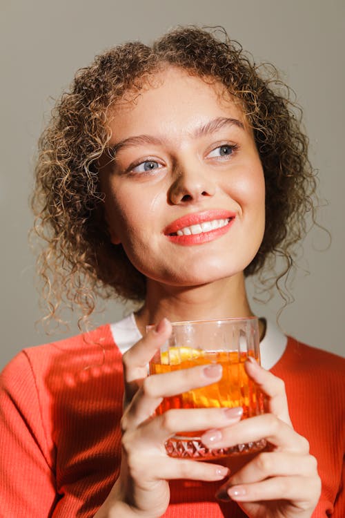 Smiling Woman Holding a Drink