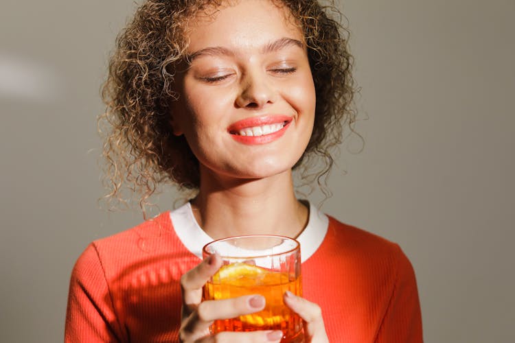 Woman Holding A Drink