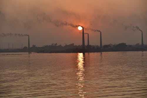 Безкоштовне стокове фото на тему «дим, димоходи, Захід сонця»