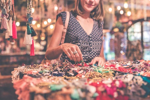 Free Woman Selecting Beaded Jewelry Stock Photo