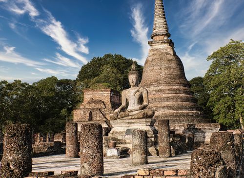 Free Serene Buddha statue at ancient Sukhothai Historical Park, Thailand, showcasing spirituality and history. Stock Photo