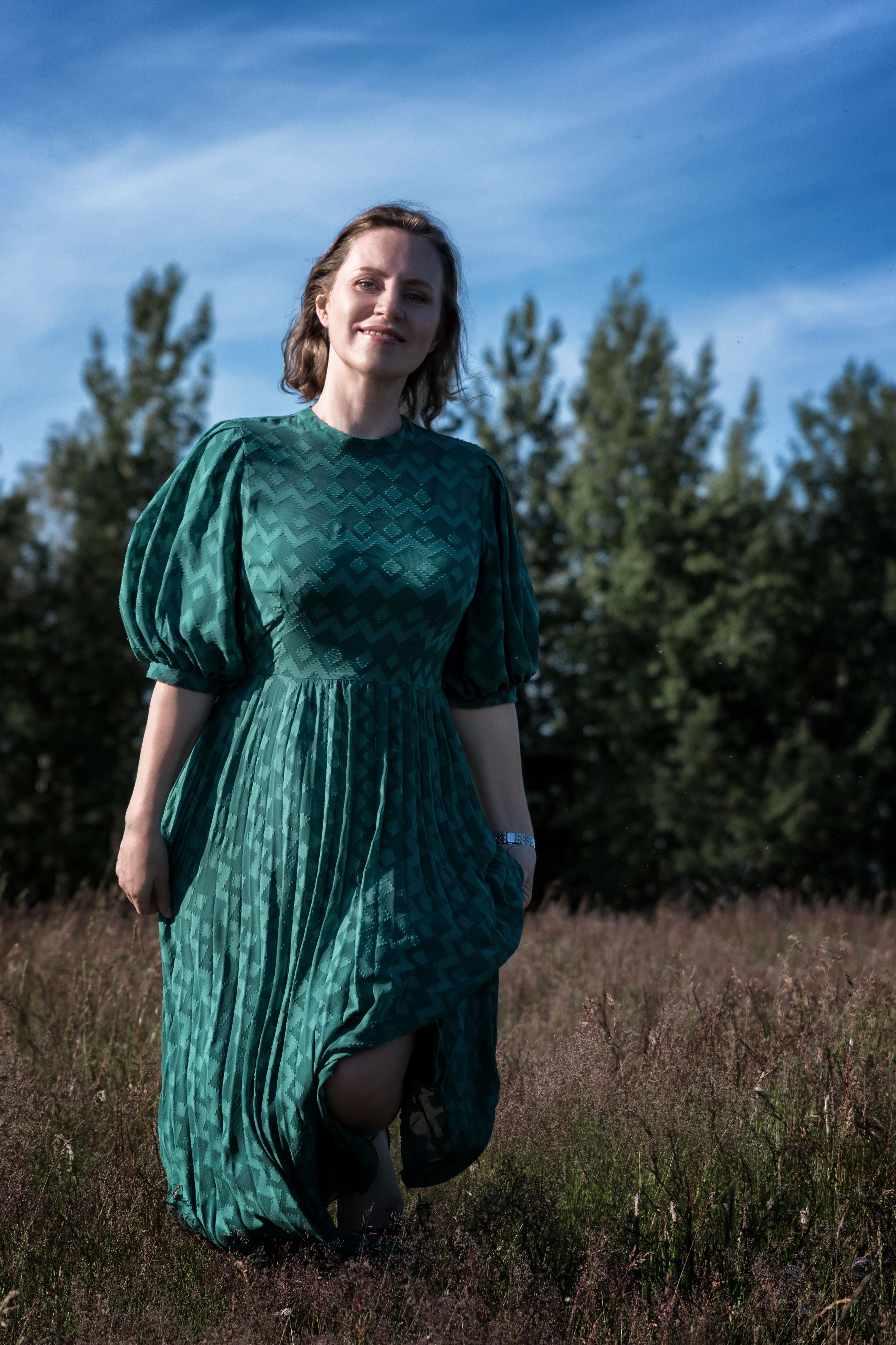 Woman in Green Dress Standing on Grass Field · Free Stock Photo