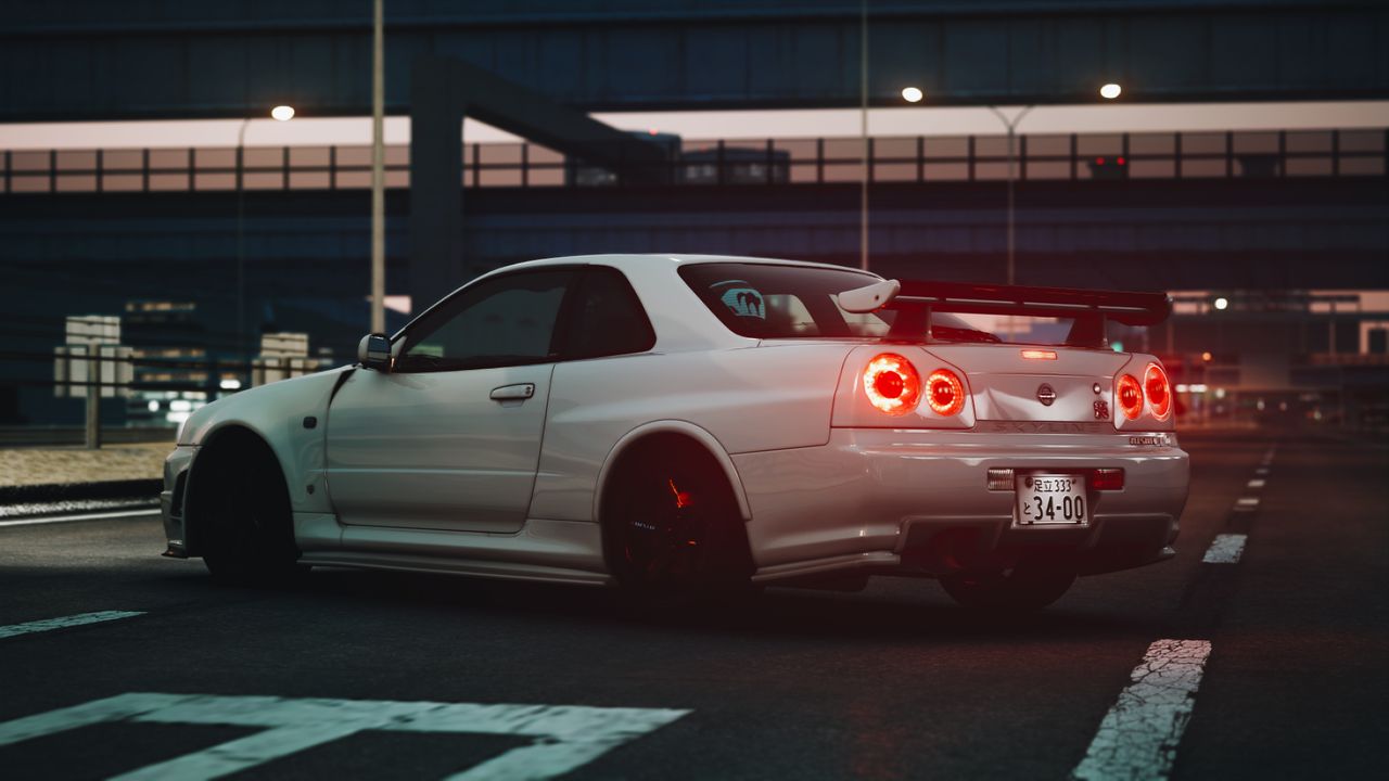 a white nissan sports car parked under a bridge at night showcasing lu