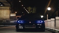 A Blue Nissan Car parked on the Road During Night