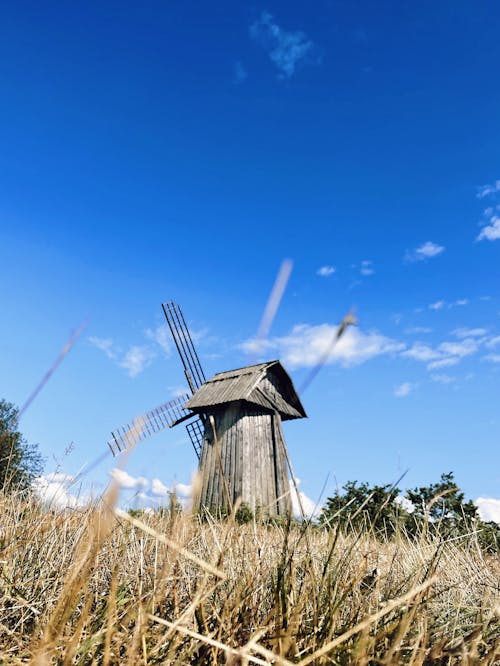 Wooden Windmill Under Blue Sky