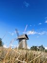 Wooden Windmill Under Blue Sky