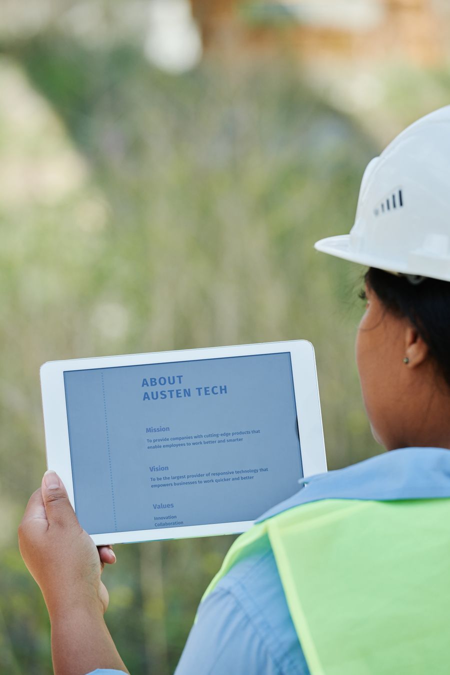 Contractor reviewing plans on a tablet