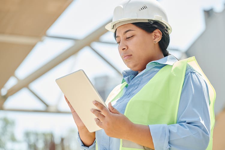 An Engineer Using A Digital Tablet