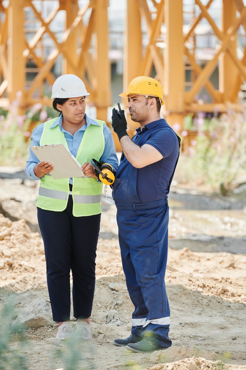 Contractors Meeting and Reviewing Plans