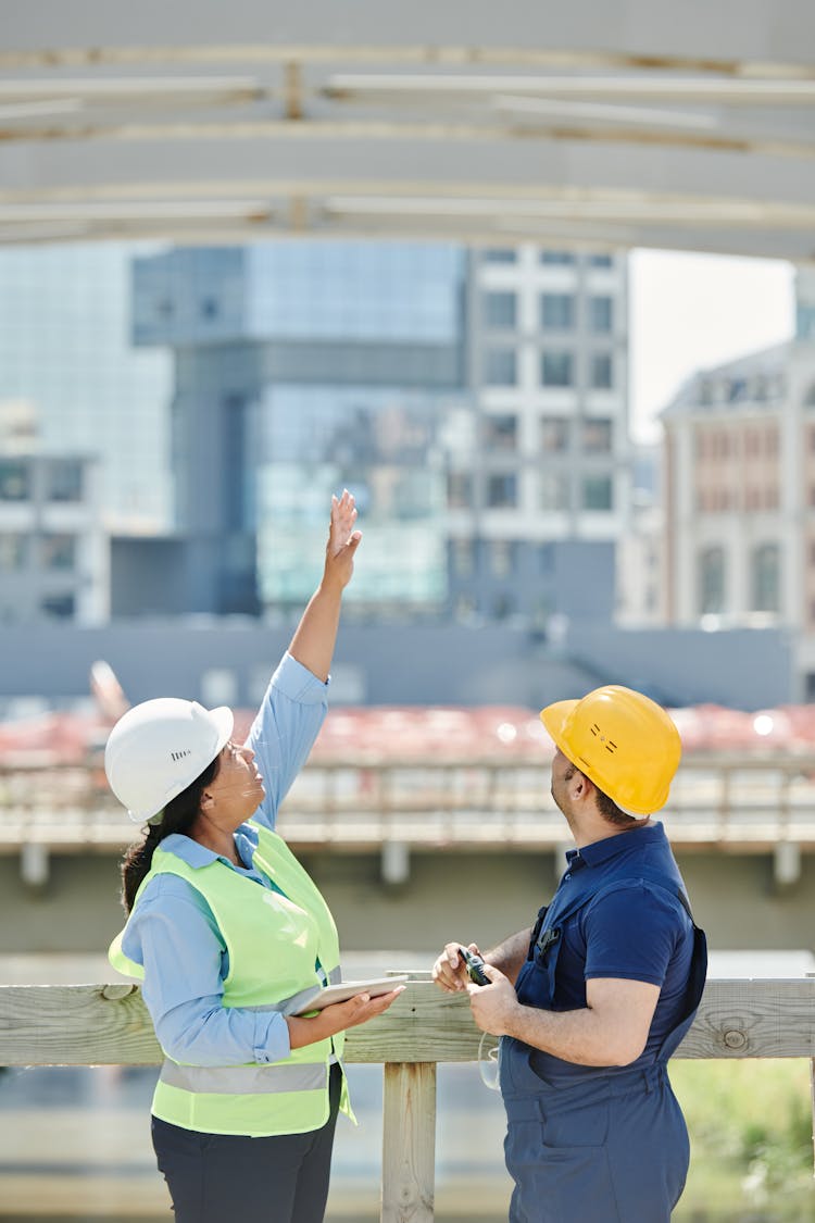 A Man And Woman Talking About Architecture