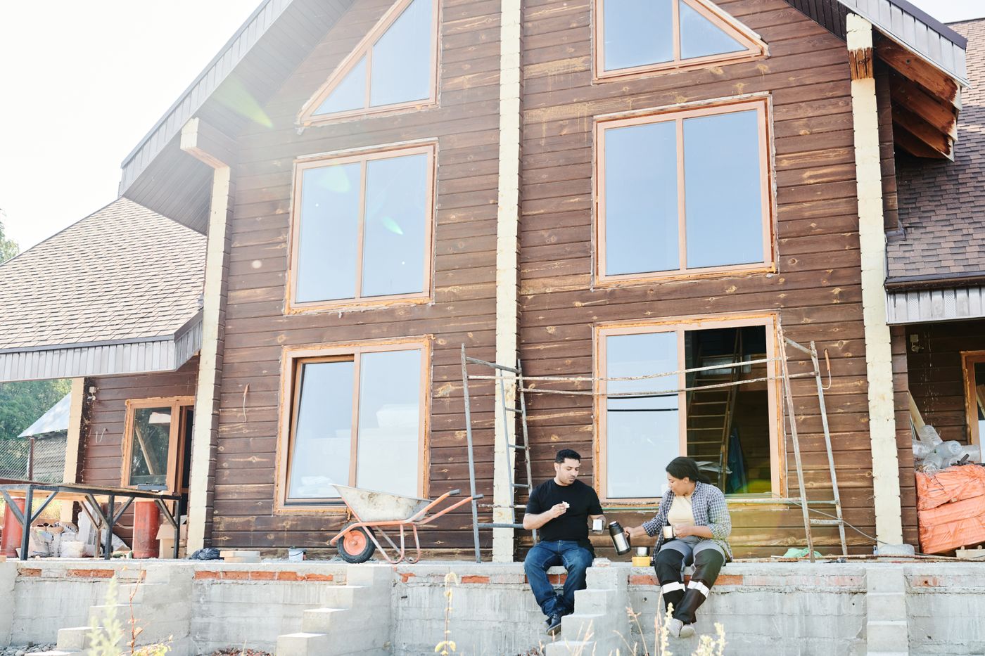 Construction workers at a house under construction during an early project-stage review