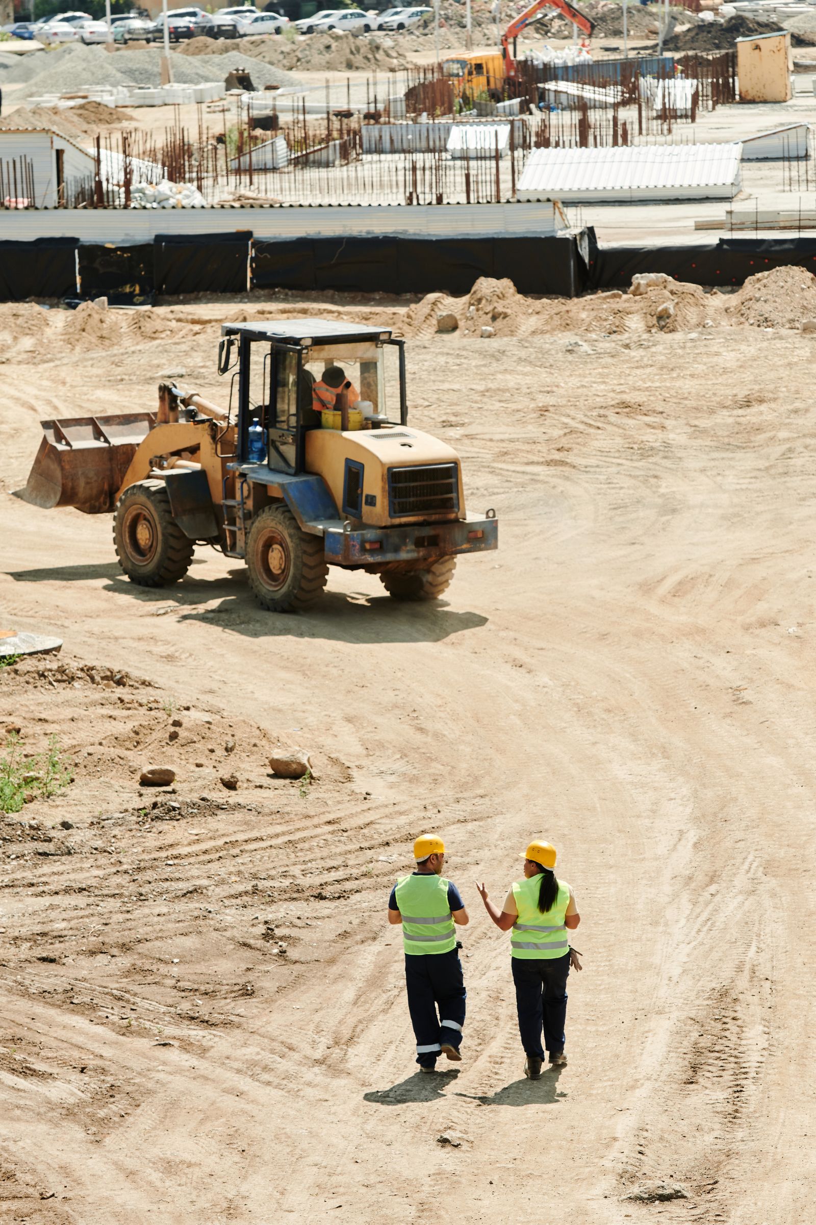 Supervisor safety coaching on a site walk to reinforce behavior change over box-checking