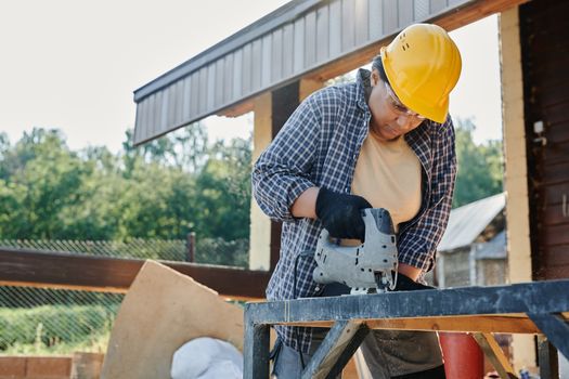 Woman in Blue and White Plaid Shirt Wearing Yellow Hard Hat
