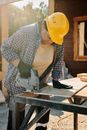A Woman Working with Woods