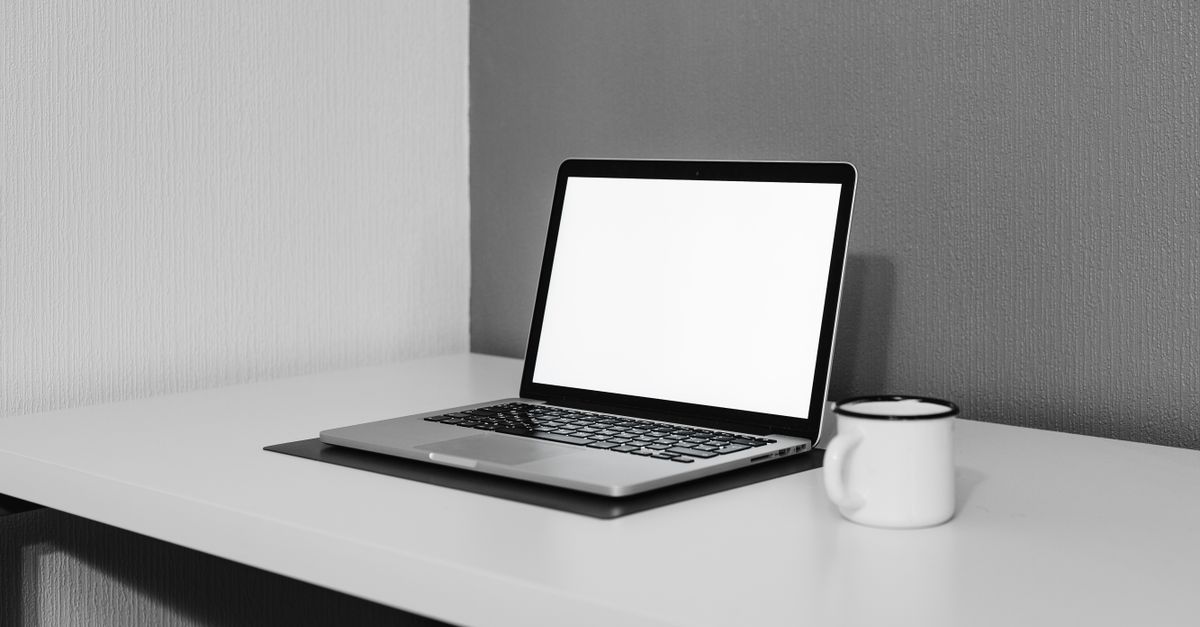 minimalist home desk with simple mug and no clutter
