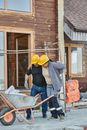 A Construction Worker Helping a Colleague Walk