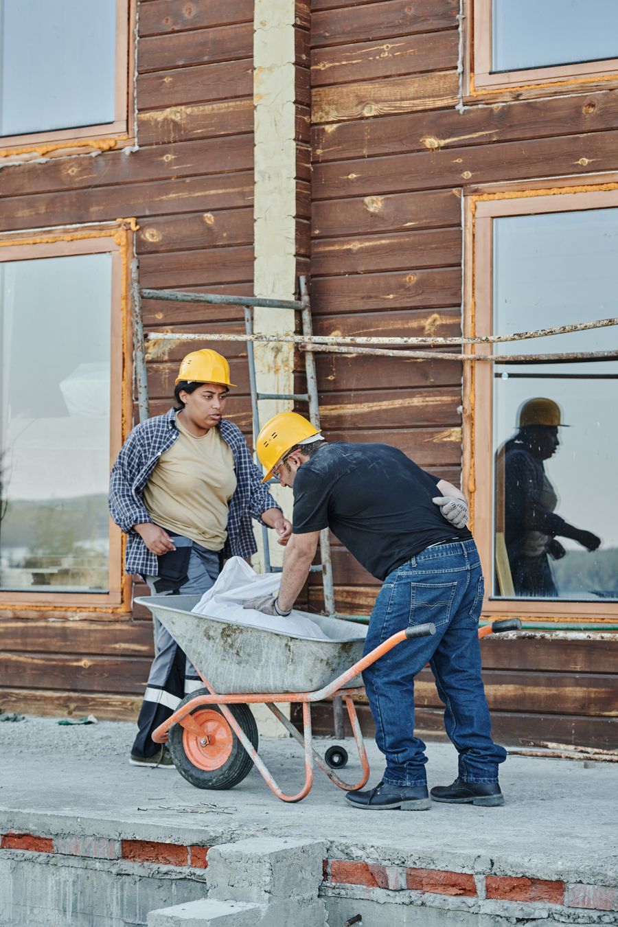 Pete Marlow and the Marlow Built crew reviewing plans at a timber frame — Sunshine Coast