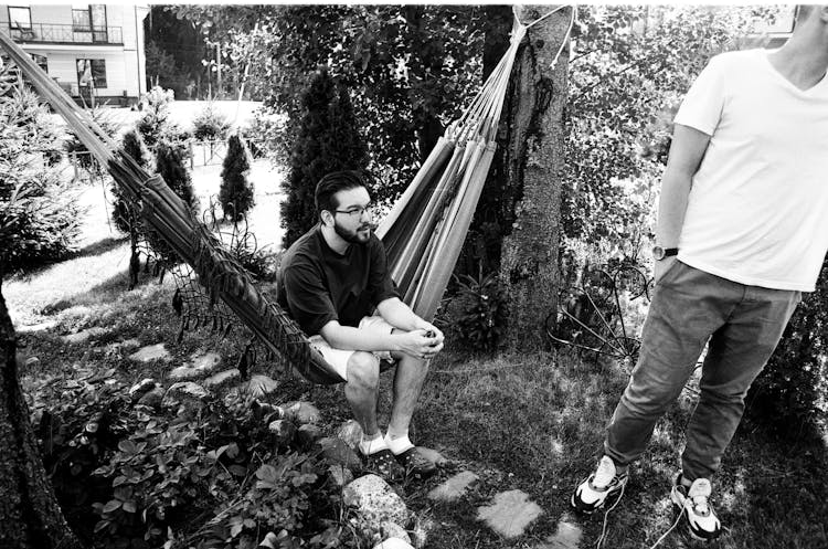 Man In Black Shirt Sitting On Hammock