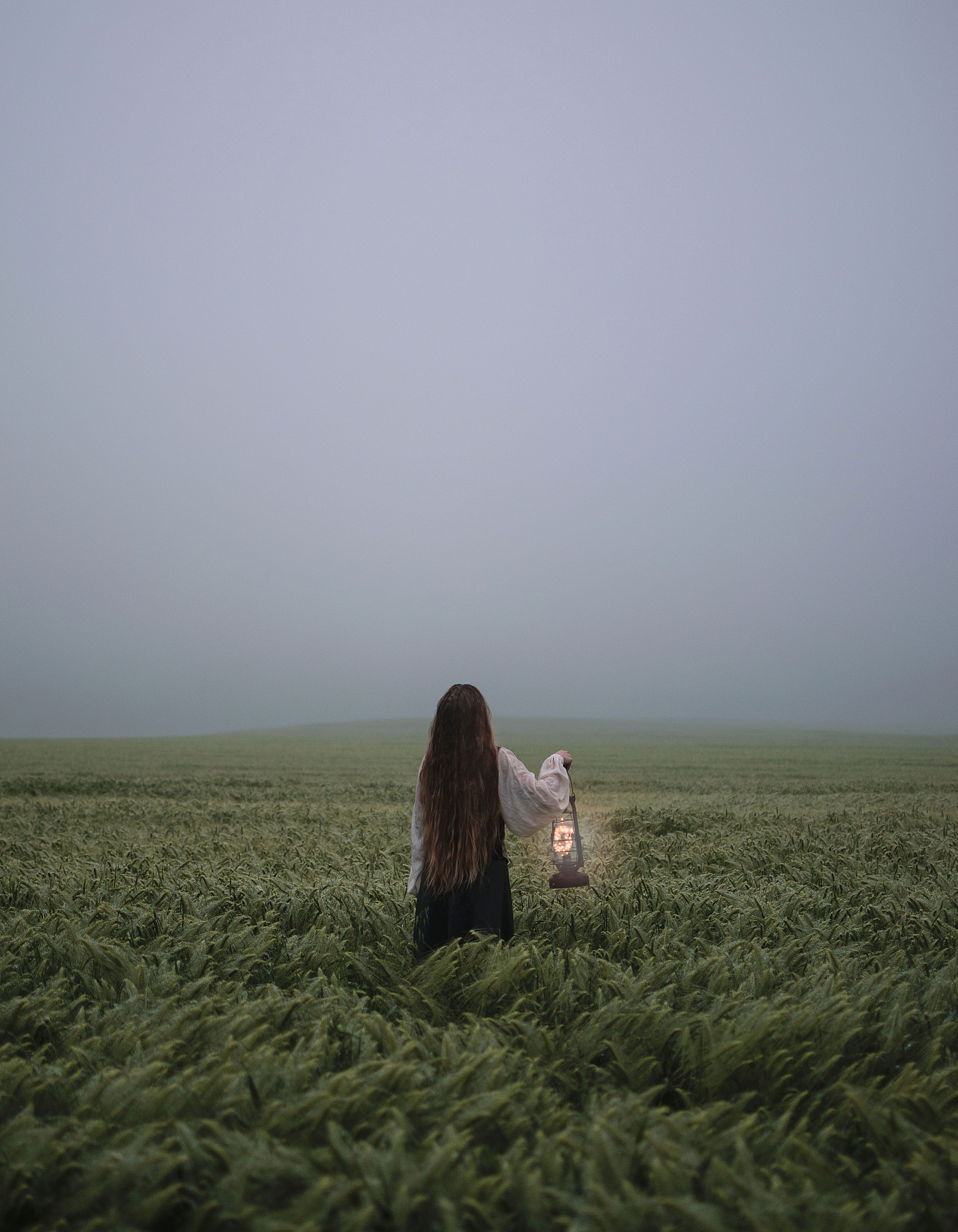 Woman in Red Long Sleeve Shirt Standing on Green Grass Field · Free ...