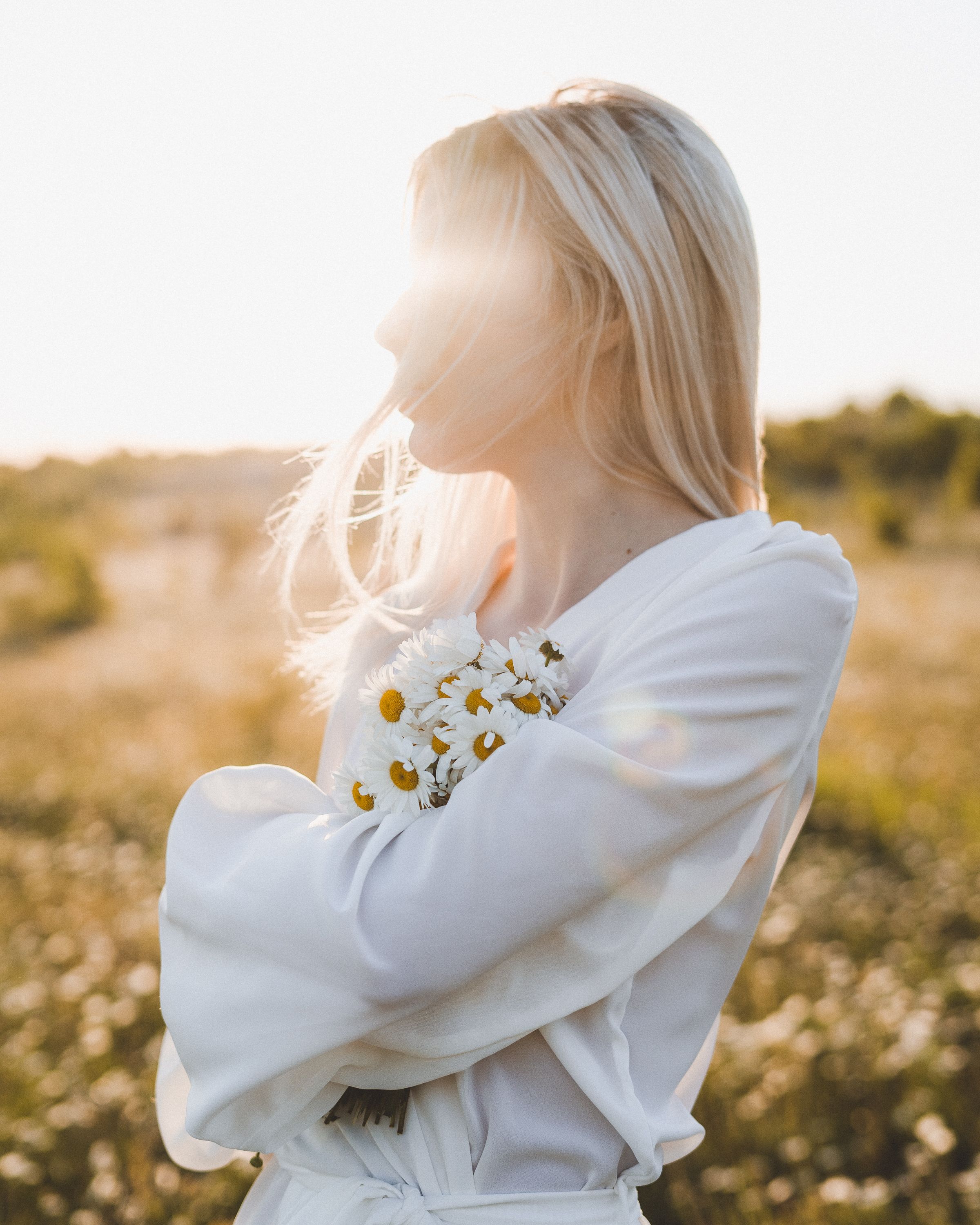 Woman standing near green plants in summertime · Free Stock Photo