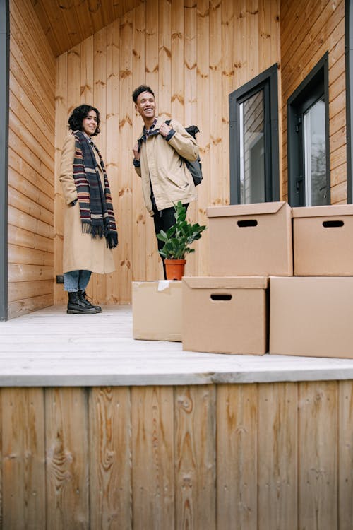 Free Stacked of Cardboard Boxes in Front of the Door  Stock Photo
