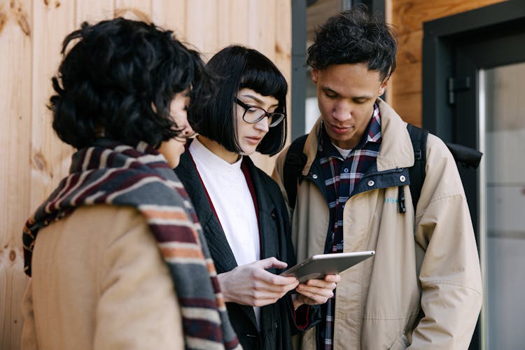 People Looking At The Tablet Computer