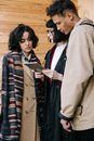 Woman in Brown Coat Standing Beside Woman in Black Coat
