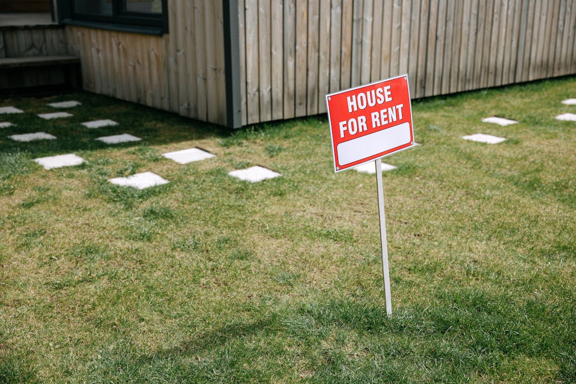 Free Red And White Sign Board On The Lawn Grass Stock Photo