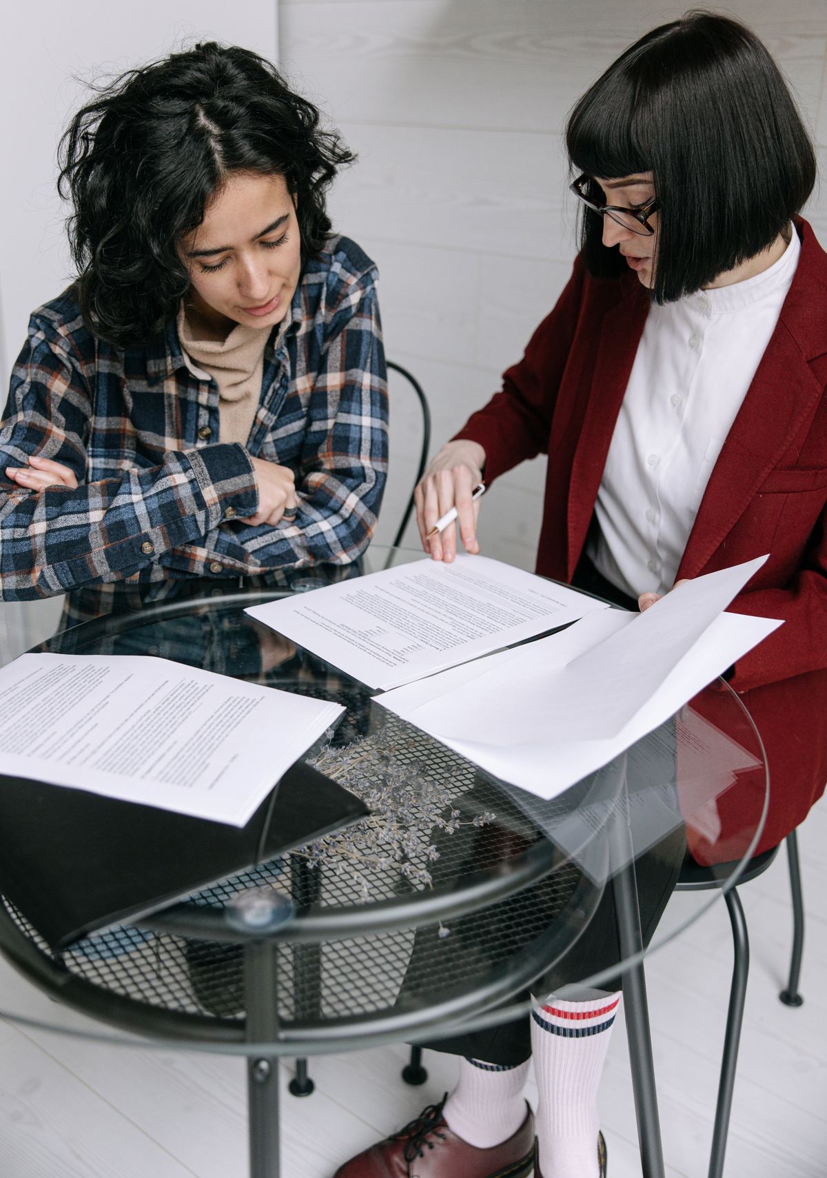 Two women reviewing documents together