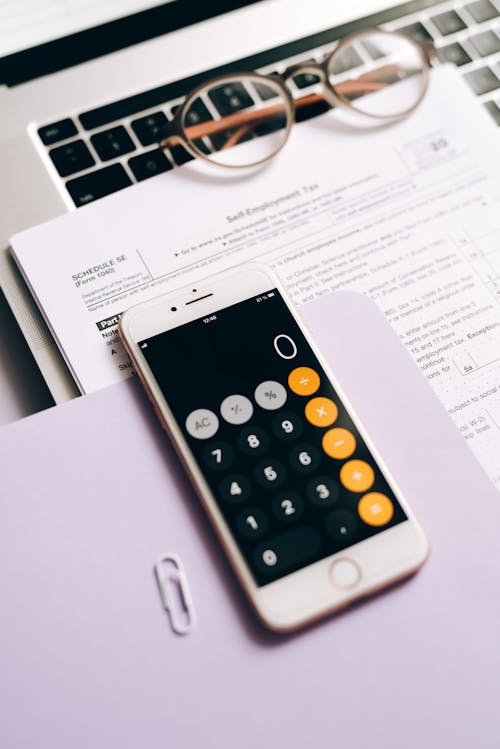 A Mobile Phone with Calculator on the Table